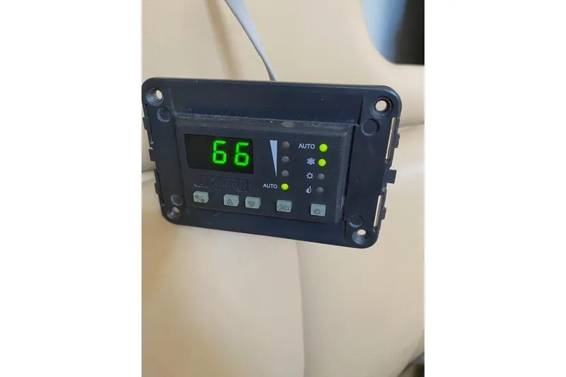Slide: The Image of Digital control panel on a 2005 Rinker Fiesta Vee 320 boat displaying temperature. - 21