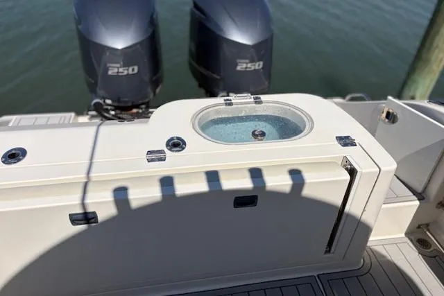 Slide: The Image of 2019 Cobia 280 Center Console boat with twin 250 engines and livewell. - 18
