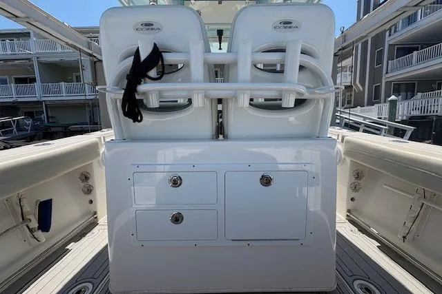 Slide: The Image of 2019 Cobia 280 Center Console boat interior with dual seats and storage compartments. - 20