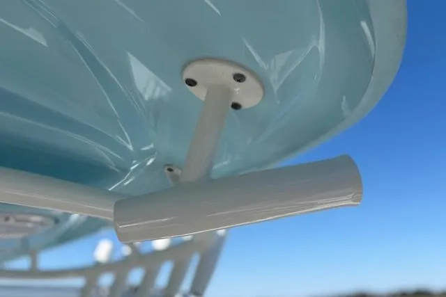 Slide: The Image of 2019 Cobia 280 Center Console boat detail against clear blue sky. - 42