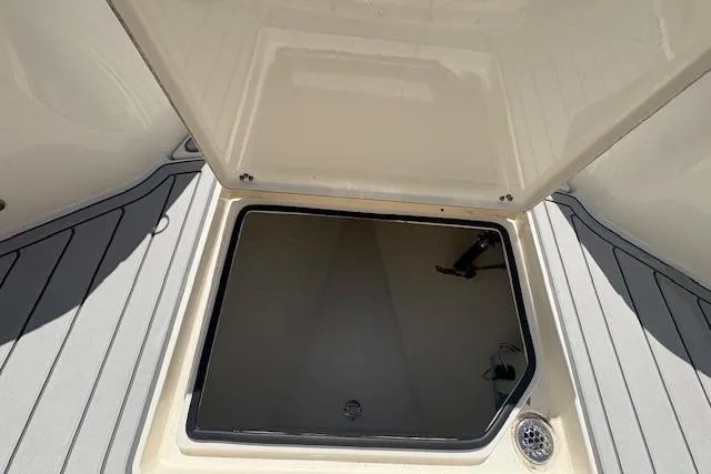 Slide: The Image of Open storage compartment on 2019 Cobia 280 Center Console boat deck. - 44