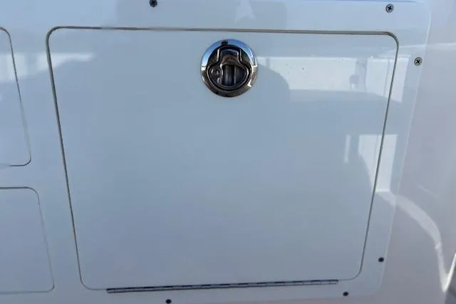 Slide: The Image of 2019 Cobia 280 Center Console hatch with chrome handle detail. - 46