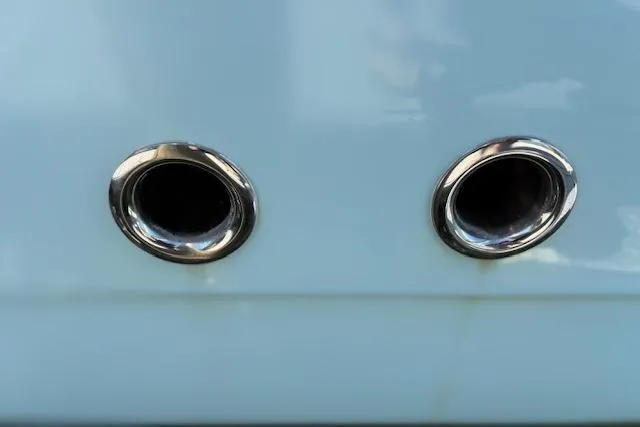 Slide: The Image of 2019 Cobia 280 Center Console boat exhaust ports, close-up view. - 49
