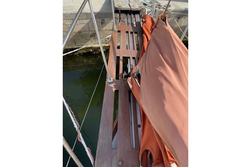 Slide: The Image of Wooden deck of 1939 Alden Graves Coastwise Cutter 36 with folded sail. - 15