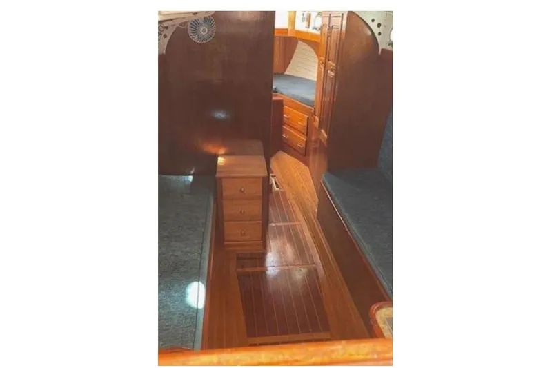 Slide: The Image of Interior of 1939 Alden Cutter yacht with wooden furnishings and cozy seating. - 3