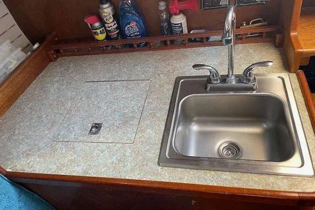 Slide: The Image of 1939 Alden Graves Coastwise Cutter 36 galley with sink and countertop essentials. - 7