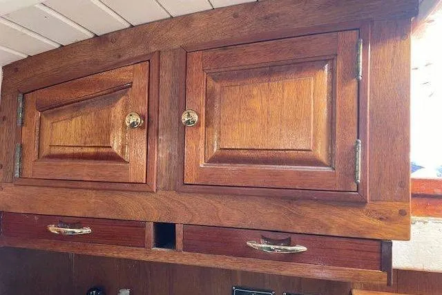 Slide: The Image of Wooden cabinetry inside a 1939 Alden Graves Coastwise Cutter 36 sailboat. - 8