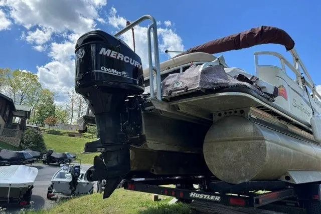 Slide: The Image of 2008 Sun Tracker Party Barge 25 Regency Edition with Mercury outboard motor on trailer. - 12
