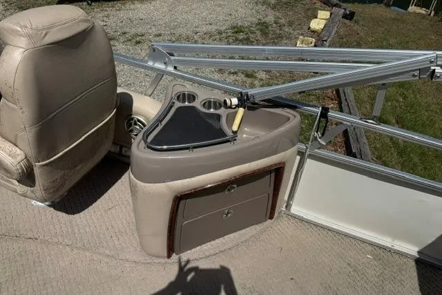 Slide: The Image of 2008 Sun Tracker Party Barge 25 Regency Edition interior with seating and storage. - 8