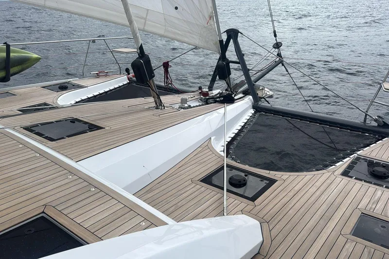 Slide: The Image of Luxury Privilege 510 catamaran deck with sleek design, sailing on open water, 2022 model. - 6