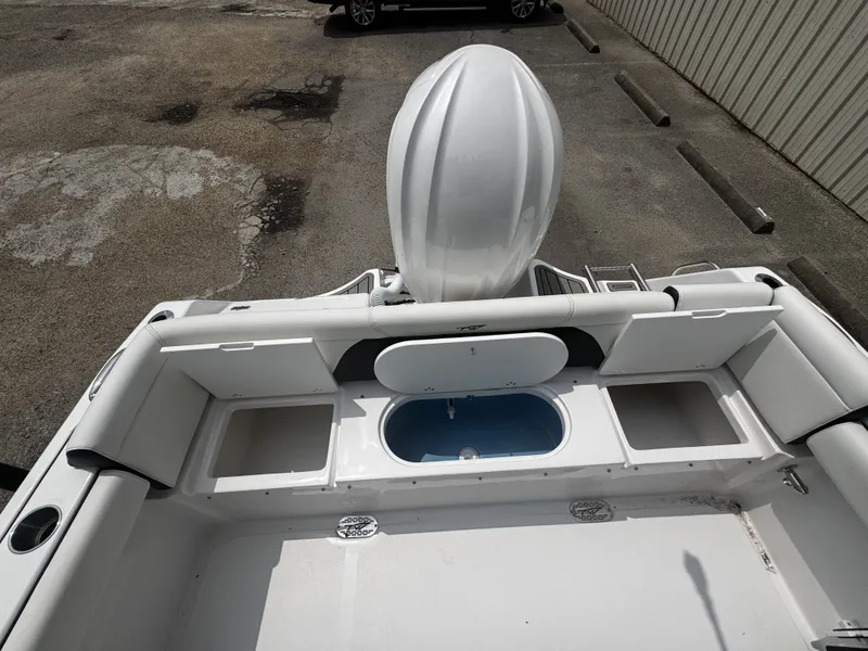 Slide: The Image of Rear view of 2026 Tidewater 232 LXF boat with storage compartments. - 11