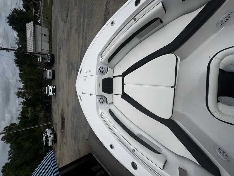 Slide: The Image of 2026 Tidewater 232 LXF boat, bow view, parked outdoors. - 15