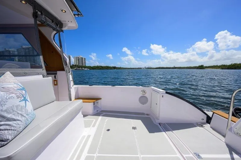 Slide: The Image of Luxurious 2022 True North 34 yacht deck with scenic waterfront view. - 19