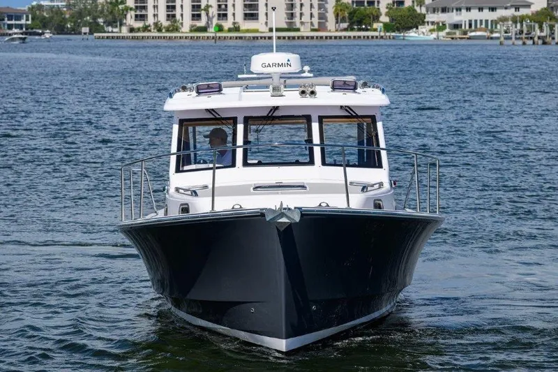 Slide: The Image of Front view of a 2022 True North 34 boat on the water. - 2