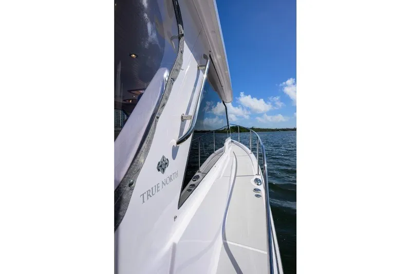 Slide: The Image of 2022 True North 34 boat on water under clear blue sky. - 43