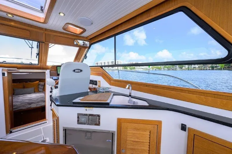 Slide: The Image of Interior of 2022 True North 34 yacht with modern kitchen and scenic water view. - 53