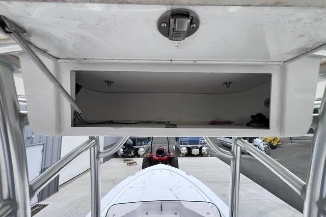 Slide: The Image of 2021 Sportsman Tournament 234 SBX Bay Boat with open storage compartment. - 12