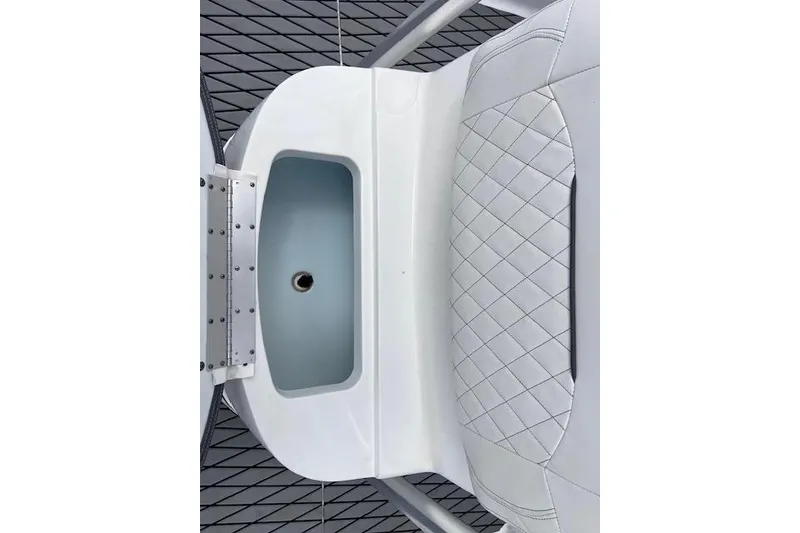 Slide: The Image of 2021 Sportsman Tournament 234 SBX Bay Boat interior with quilted seating and storage compartment. - 14