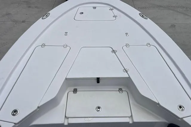 Slide: The Image of 2021 Sportsman Tournament 234 SBX Bay Boat deck with storage compartments. - 15