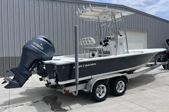 Slide: The Image of 2021 Sportsman Tournament 234 SBX Bay Boat on trailer, featuring Yamaha outboard motor. - 2