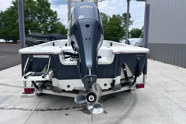 Slide: The Image of 2021 Sportsman Tournament 234 SBX Bay Boat, rear view with outboard motor. - 23