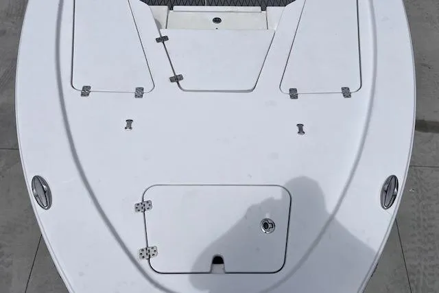 Slide: The Image of 2021 Sportsman Tournament 234 SBX Bay Boat deck, featuring storage compartments and sleek design. - 5