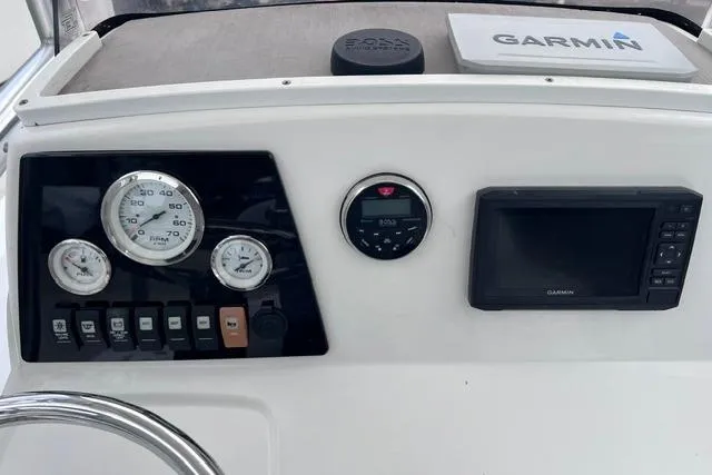 Slide: The Image of Dashboard of 2021 Sportsman Tournament 234 SBX Bay Boat with Garmin display and gauges. - 9