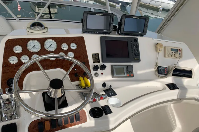 Slide: The Image of Control panel of a 2002 Silverton 42 Convertible yacht with navigation instruments. - 2