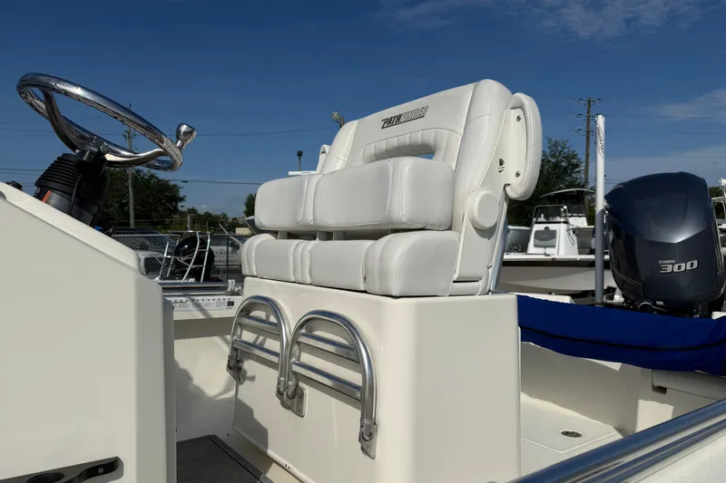 Slide: The Image of 2021 Pathfinder 2500 Hybrid boat interior with steering wheel and seating. - 10