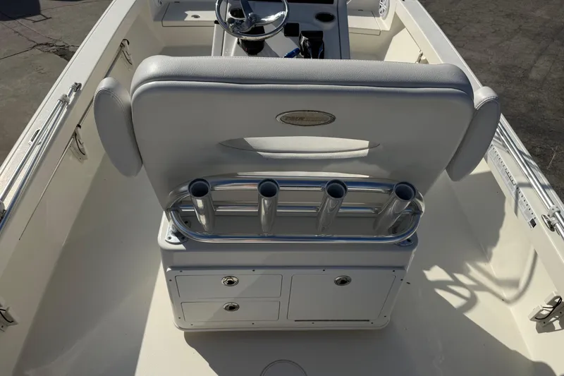 Slide: The Image of 2021 Pathfinder 2500 Hybrid boat interior with steering console and rod holders. - 11