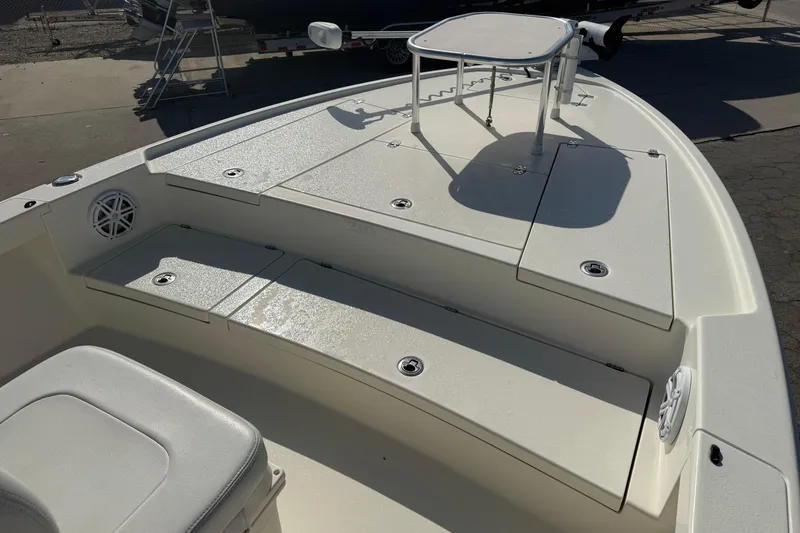 Slide: The Image of 2021 Pathfinder 2500 Hybrid boat deck with seating and storage compartments. - 14