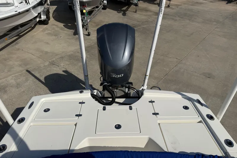 Slide: The Image of 2021 Pathfinder 2500 Hybrid boat with Yamaha 300 engine, docked on concrete. - 15