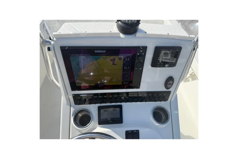 Slide: The Image of 2021 Pathfinder 2500 Hybrid boat dashboard with Simrad navigation system. - 21