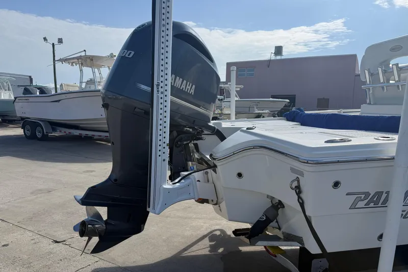 Slide: The Image of 2021 Pathfinder 2500 Hybrid boat with Yamaha outboard motor in a marina setting. - 4