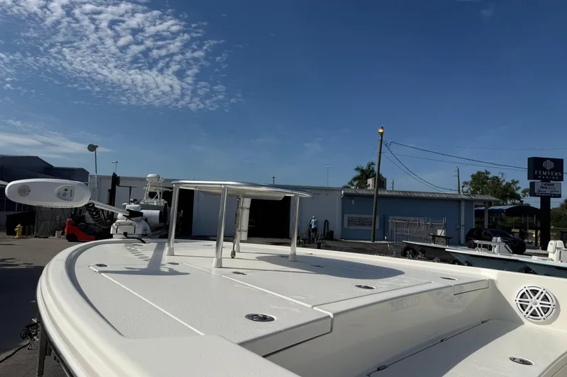 Slide: The Image of 2021 Pathfinder 2500 Hybrid boat docked under clear blue sky. - 8