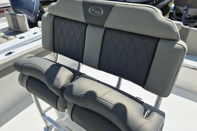 Slide: The Image of 2026 Key West 239 FS boat seating with elegant gray upholstery and diamond stitching. - 10