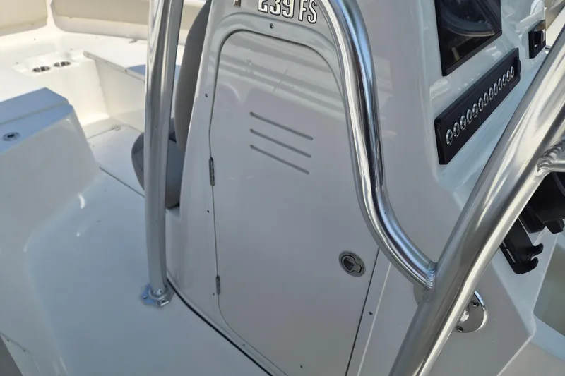 Slide: The Image of 2026 Key West 239 FS boat console with sleek design and stainless steel railings. - 11