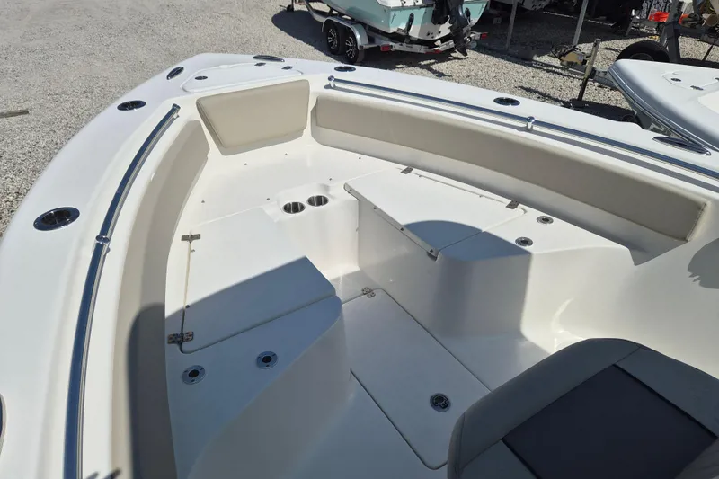 Slide: The Image of 2026 Key West 239 FS boat interior with seating and cup holders. - 13