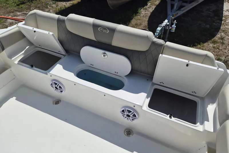 Slide: The Image of 2026 Key West 239 FS boat interior with cushioned seating and stainless steel frame. - 15