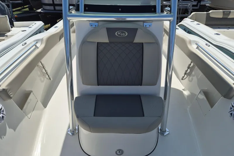 Slide: The Image of 2026 Key West 239 FS boat interior with cushioned seating and stainless steel frame. - 17