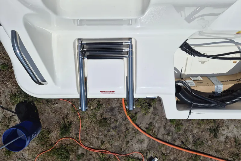Slide: The Image of 2026 Key West 239 FS boat with folded ladder and wiring on deck. - 20