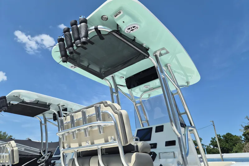 Slide: The Image of 2026 Key West 239 FS boat with T-top and rod holders against clear blue sky. - 3