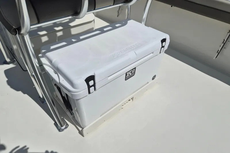 Slide: The Image of White cooler on 2026 Key West 239 FS boat deck, secured with metal brackets. - 6
