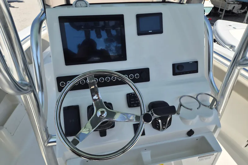 Slide: The Image of Steering console of 2026 Key West 239 FS boat with modern navigation equipment. - 7