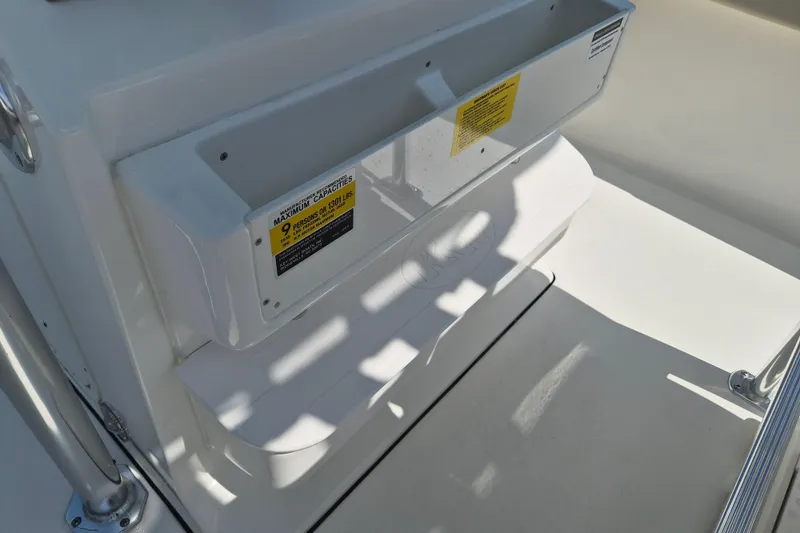 Slide: The Image of 2026 Key West 239 FS boat interior with seating and capacity label. - 9