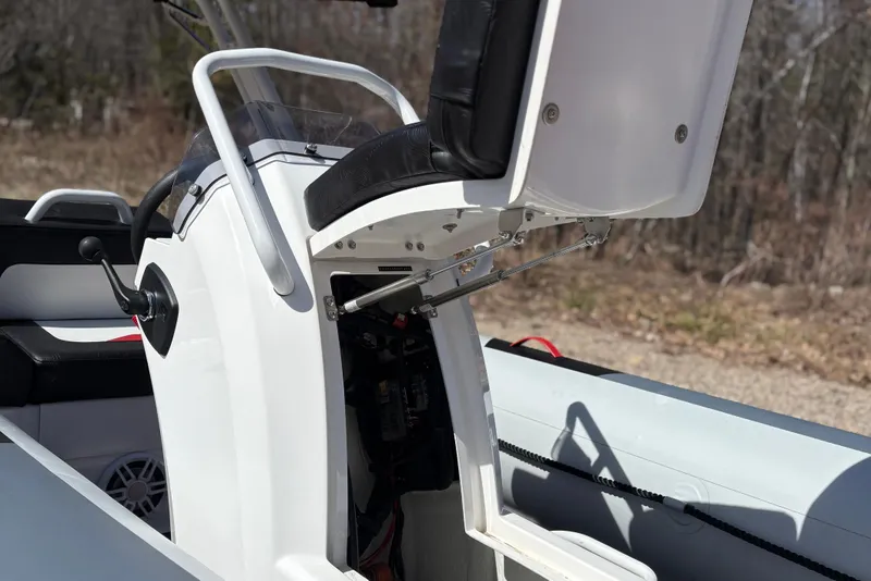Slide: The Image of Highfield Velox 420 boat console with open storage, year 2025. - 18