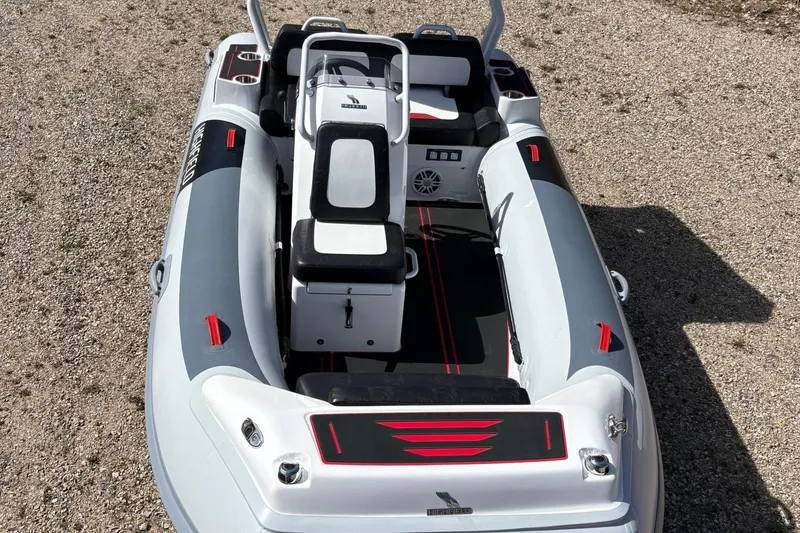 Slide: The Image of Highfield Velox 420 inflatable boat, 2025 model, on gravel surface. - 2