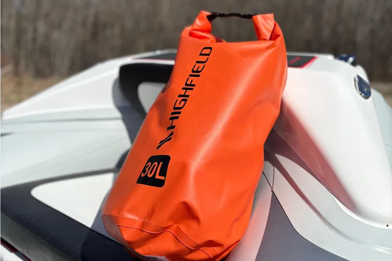 Slide: The Image of Orange Highfield 30L bag on Velox 420 boat, 2025 model. - 22