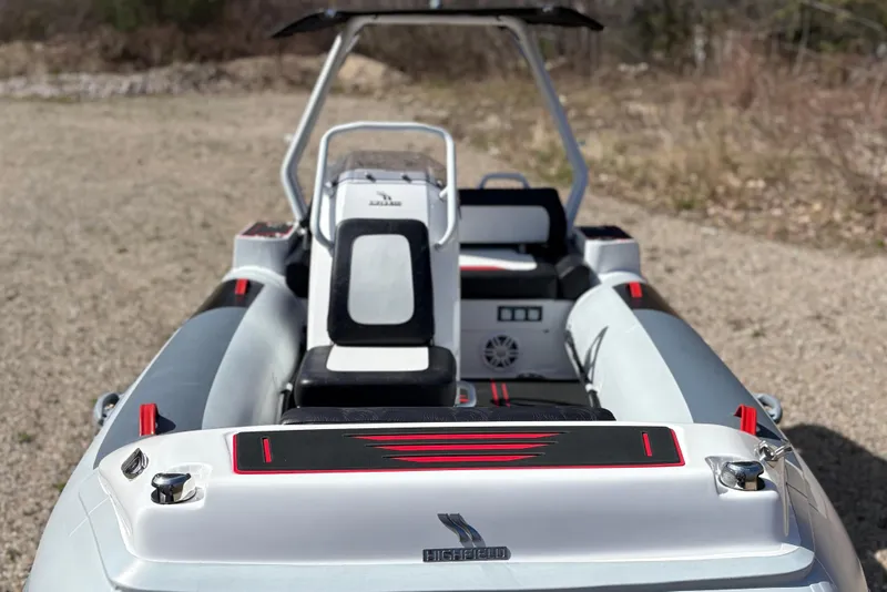 Slide: The Image of Highfield Velox 420 boat, 2025 model, parked on gravel surface. - 3