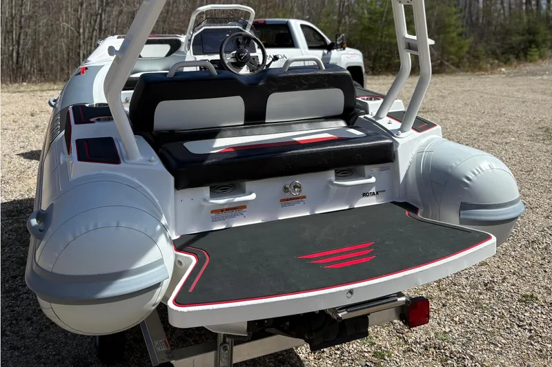 Slide: The Image of Rear view of Highfield Velox 420 boat, 2025 model, on a trailer. - 6